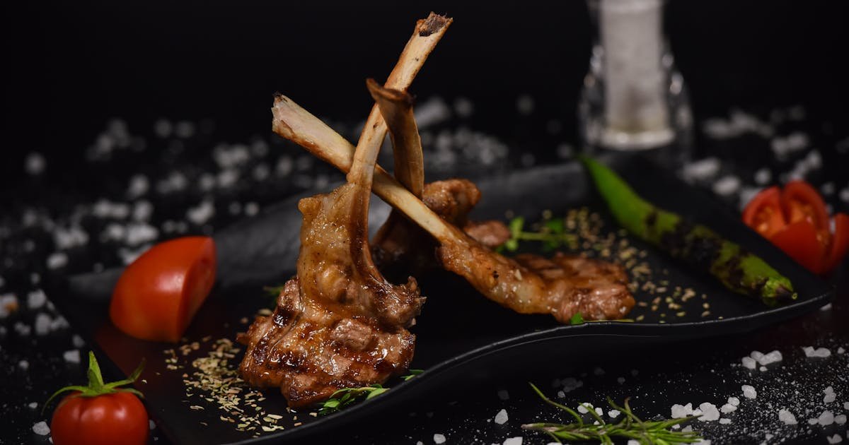 Herb-crusted lamb chops seared on the grill