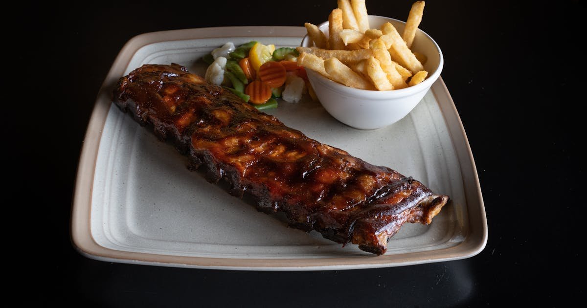Slow-cooked BBQ pork ribs with smoky glaze