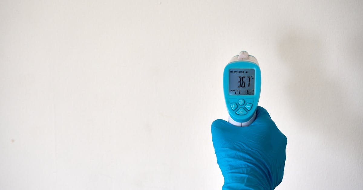 Checking internal meat temperature with a thermometer